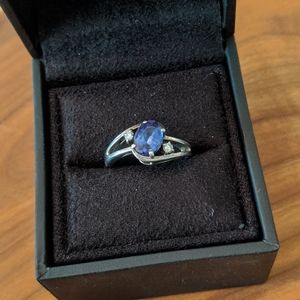 Silver split shank tanzanite and diamond ring